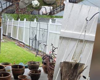 Tons of outdoor yard art, clay pots, statues,  cypress knee planter.