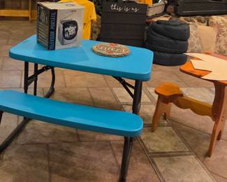 Child's picnic table and wooden child's desk, camping gear