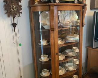 Oak China Cabinet filled with Crown potteries, 8 pc place setting, made in USA