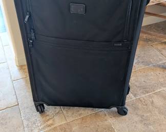 Tumi Alpha 3 Large Expandable 4-Wheeled Checked Suitcase. Tumi is the "gold standard" for business travel, and the Alpha series is their flagship line made from ultra-durable FXT Ballistic Nylon.