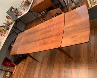 #30 Teak wood table adjustable height w built in extentions 46-72 L x 26 w x 25-29" H $125.00