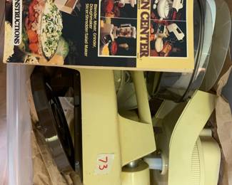 #73 Oster kitchen center set with blender, mixer, grinder, doughmaker, shredder w/book $50.00