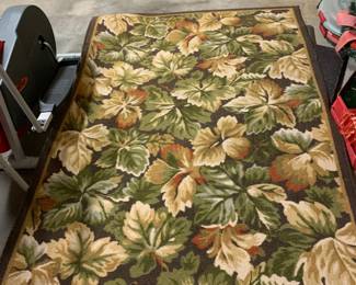 #59 Machine made rug w brown leaf pattern 52x83" $40.00