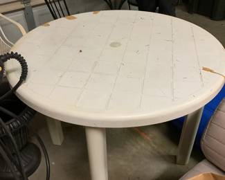 #53 Round white plastic patio table 35" round x 29" tall $20.00