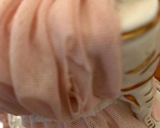 #92 dresden lace porlain lady with piana as is small chip $75.00