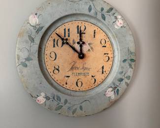 Painted, battery operated metal clock, 13.25”