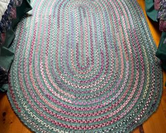 Vintage braided oval rug, measures 6’ x 49”