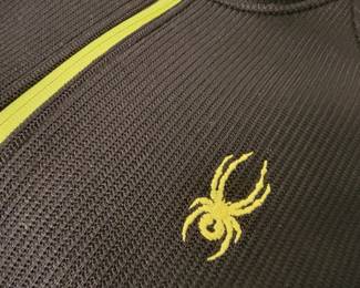 No, the spider isn't real, it's "Spyder" brand clothing