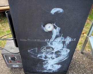 Bradley outdoor smoker - the white area isn't damage - it's actually the way it comes and represents smoke!