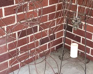 Hard to photograph, but on the left is a snowman and to the right is a plant stand.