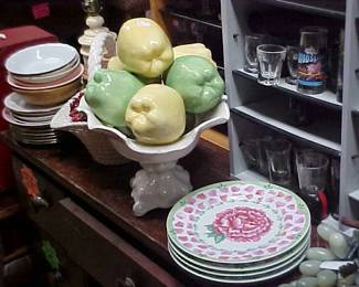 Artificial fruit, plates, bowls, glassware.