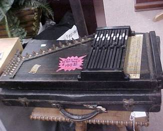 Call it a Harpsichord, Zither, or Autoharp, we have at least 3 of them in the store.