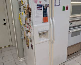 White Side-by-Side Refrigerator with Ice and Water Dispenser