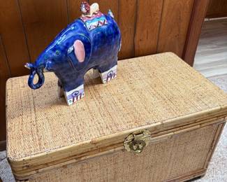 Wicker storage chest and vintage ceramic elephant 