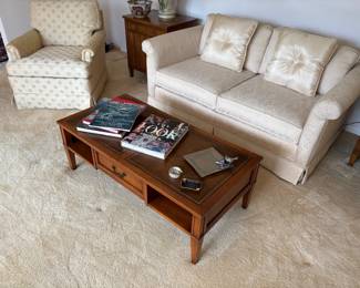 Ivory loveseat with low profile, upholstered armchair, and low-profile coffee table 