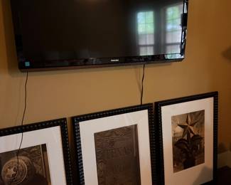 TV and Framed Western Art