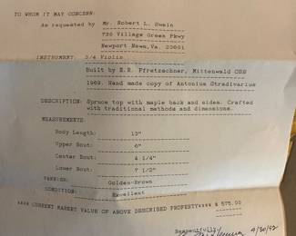 Violin in case with appraisal