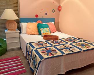 full bed with hand made quilt