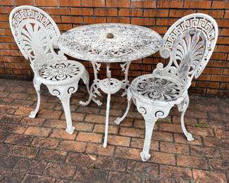 ornate aluminum table and 2 chairs