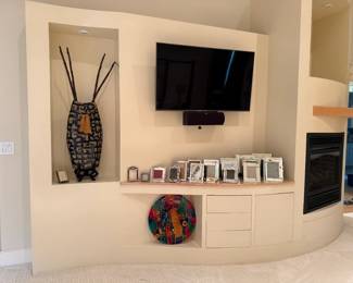 mirrored frames large vase and tv 