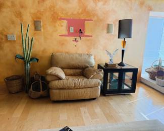 leather chair and lighted end table with art deco lamp