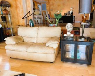 leather love seat and lighted end table