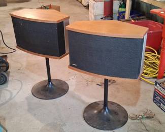 vintage Bose 901 Series Direct/Reflecting speakers mounted on pedestals. 