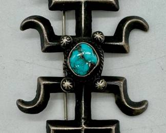 Sterling silver and turquoise brooch.