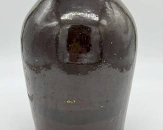 Brown glazed stoneware jar with hand painted flowers.