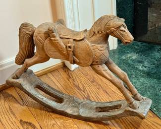 Folk art carved rocking horse toy.