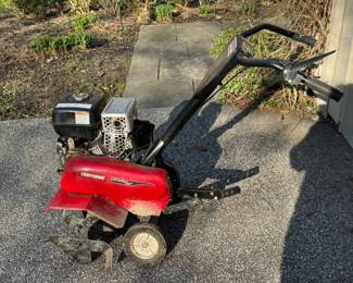 Craftsman 24" front tine tiller.