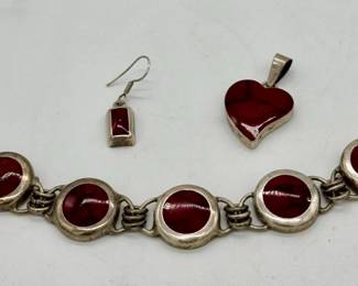 Sterling silver and red stone bracelet and pendant.