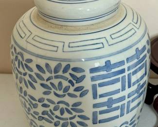 Blue and white ginger jar on stand.