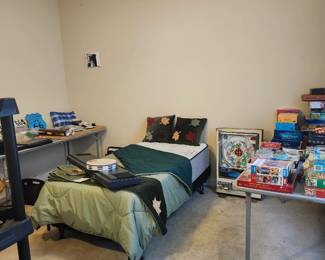 Twin bed with sheets and box spring