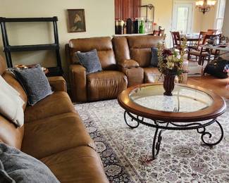 living room. shows loveseat and matching couch and coffee table