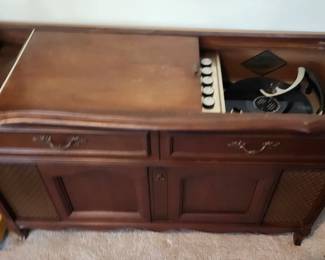 Vintage record player in cabinet