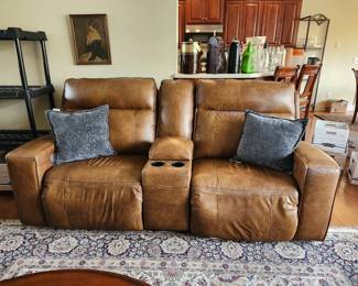 Loveseat with electric. has matching leather couch
