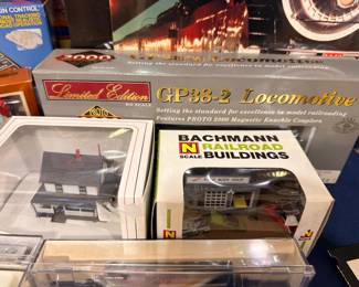 Proto 2000 GP38-2 locomotive and Bachmann N scale railroad buildings