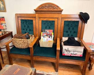 Antique oak three-seat church pew with tufted green velvet