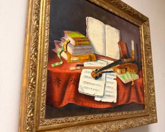 Ornate gold framed still life oil painting with books