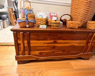 Cedar hope chest with Longaberger basket collection on top
