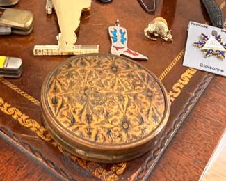 Carved wooden trinket box with small collectibles