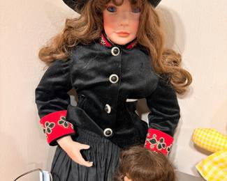 Porcelain cowgirl doll in black western dress with hat