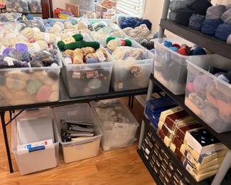 Large yarn collection with bins of knitting and crochet supplies