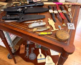 Collection of pocket knives, watches, and vintage collectibles