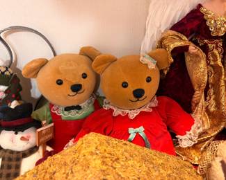 Plush bear couple in red dresses with Christmas decor