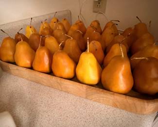 Decorative artificial pears in wooden tray