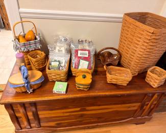 Longaberger basket collection atop cedar chest