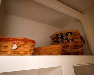 Longaberger basket collection on shelf