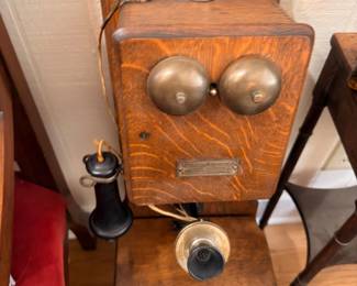 Antique oak wall crank telephone with brass bells